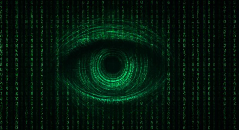 Digitales Auge im Matrix-Stil vor grünem Code-Hintergrund – symbolisiert KI-Überwachung und Datenerfassung in einer vernetzten Welt